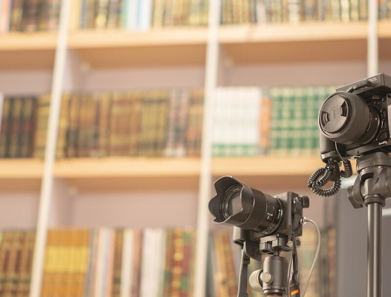 black dslr camera on black tripod