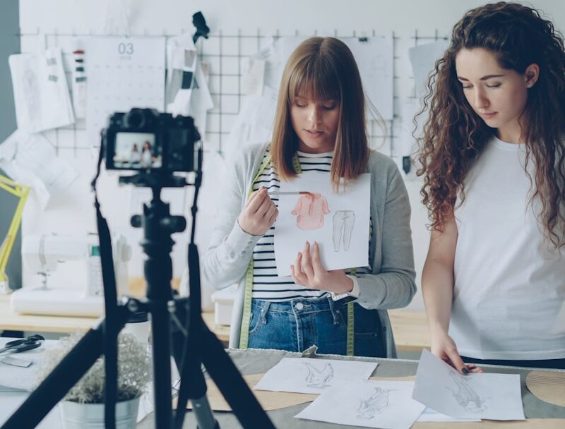 Two women record a tutorial video together.