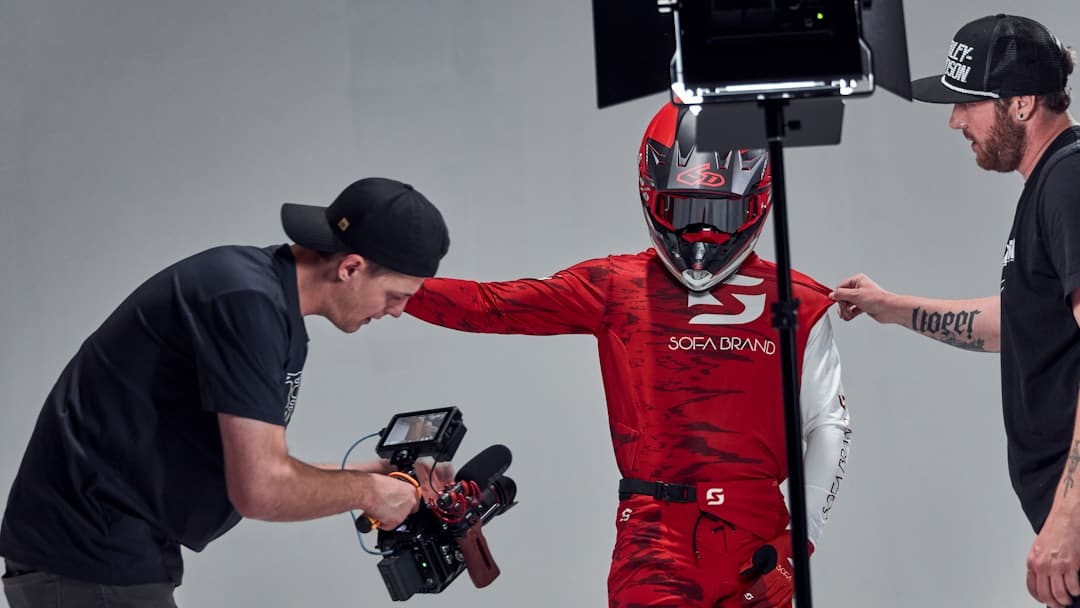 a man in a red suit and a man in a black shirt