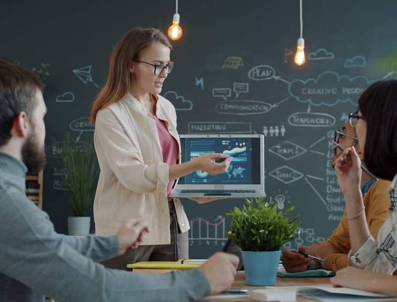 Woman presenting a business strategy to colleagues