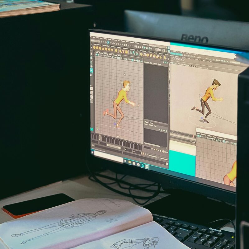 Monitor showing an animation of a man in a yellow shirt running