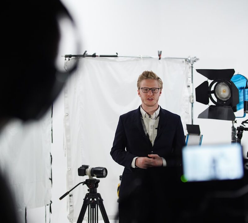 a person standing next to a camera