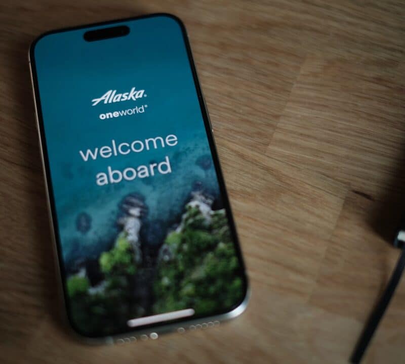 A cell phone sitting on top of a wooden table