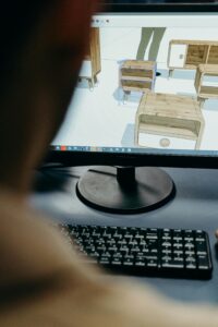 Close up of a monitor with 3D renders of end tables lined up in rows