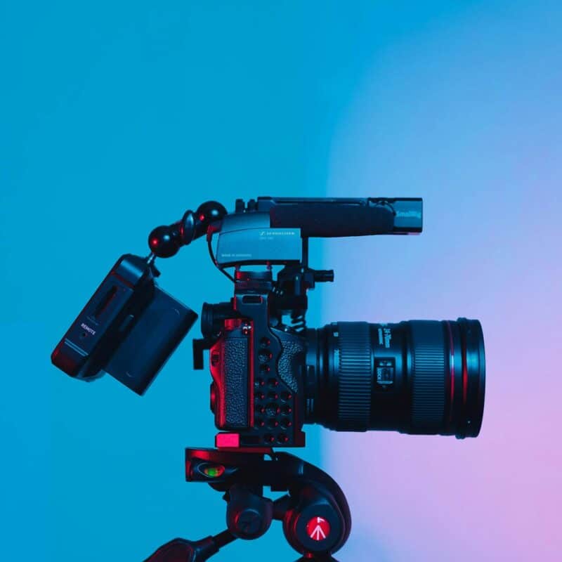 black dslr camera on green surface