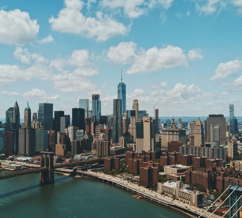 wide angle photo of Brooklyn Bridge under cloudy sky