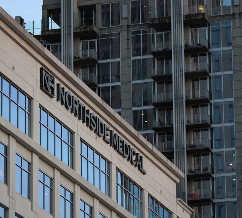 a tall building with a clock on the top of it