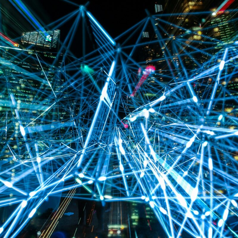 Blue lines connecting locations and satellites and objects to simulate the movement of data and information